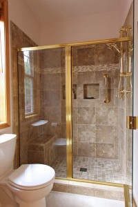 Master Bathroom shower - Porcelain tile with brass finishes